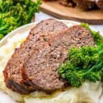 air fryer meat loaf slices over mashed potatoes with broccolini